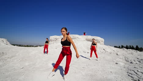 young women dancing in a quarry
