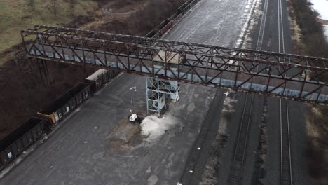 drone pan around an old metal bridge over rail tracks