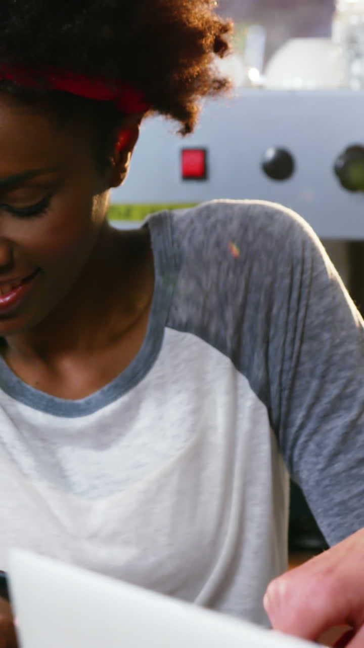 Group of friends using mobile phone and laptop