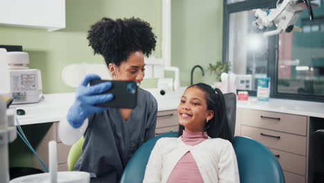 dentist taking a selfie with a young patient