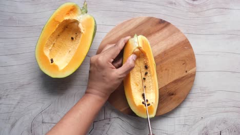 cutting a papaya