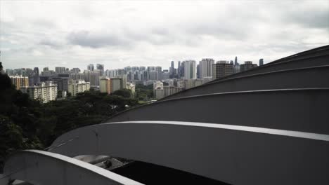 view of singapore public housing estates from henderson waves at daytime - aerial drone shot