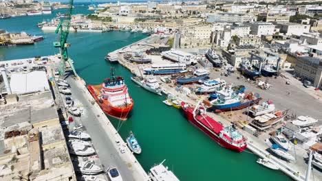 Aerial-shot-over-a-ship-yard-with-a-spectacular-view-of-Malta-harbors