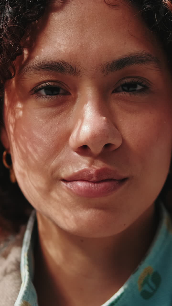 Portrait of a Happy Young Woman Smiling at the Camera