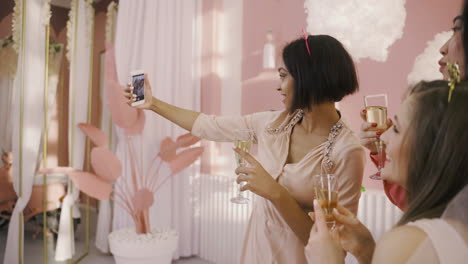 side view of a group of friends taking a selfie at a bachelorette party