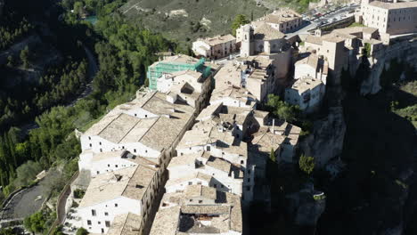 cliffside houses on beautiful mountain in cuenca, spain - aerial