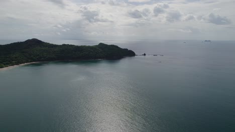 A-4K-drone-shot-of-Punta-Sabana-Point-and-the-Mirador-Conchal-Peninsula-next-to-Puerto-Viejo-and-Playa-Conchal,-or-“Shell-Beach”,-along-the-north-western-coast-of-Costa-Rica