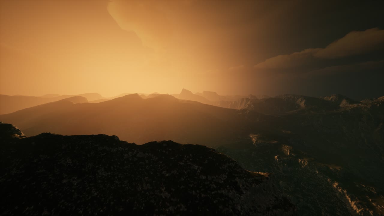 High mountain peaks covered with dramatic heavy fog