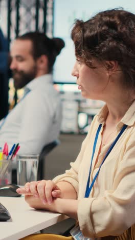 vertical video woman engaging in discussion on video call to share finance strategy details