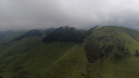 heavy low overcast on aerial flight, green grass hills of rift valley