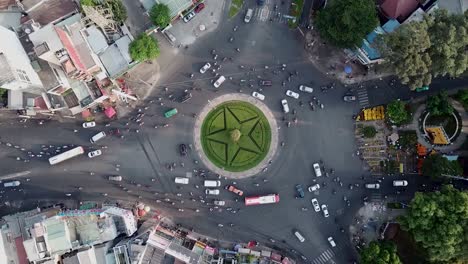 zooming in shot of a busy roundabout during rush hour in ho chi minh city, saigon, vietnam