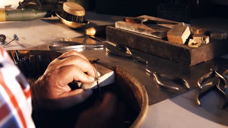 goldsmith working in workshop