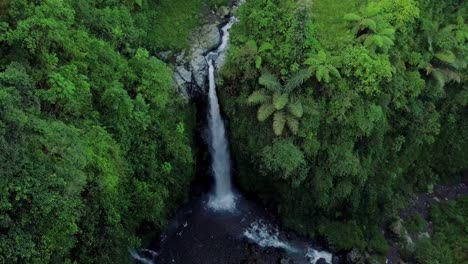 aerial view of kedung kayang waterfall in the morning which surrounded by green forest attracts tourist towards it