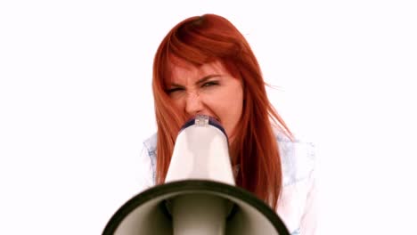 angry businesswoman screaming in a megaphone