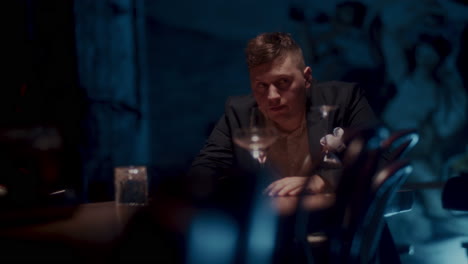 man sitting at a bar