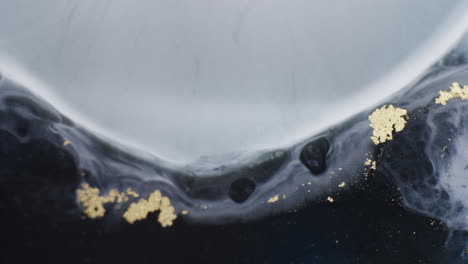 black and gray ink motion creating a tsunami abstract form