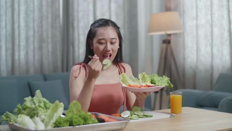 Smiling Asian Woman Enjoys Eating Healthy Food At Home