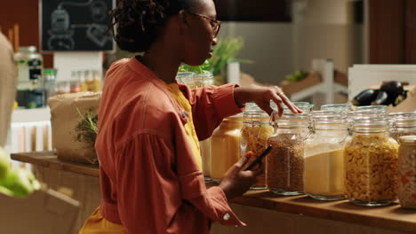 customer checking shopping list on phone before choosing products