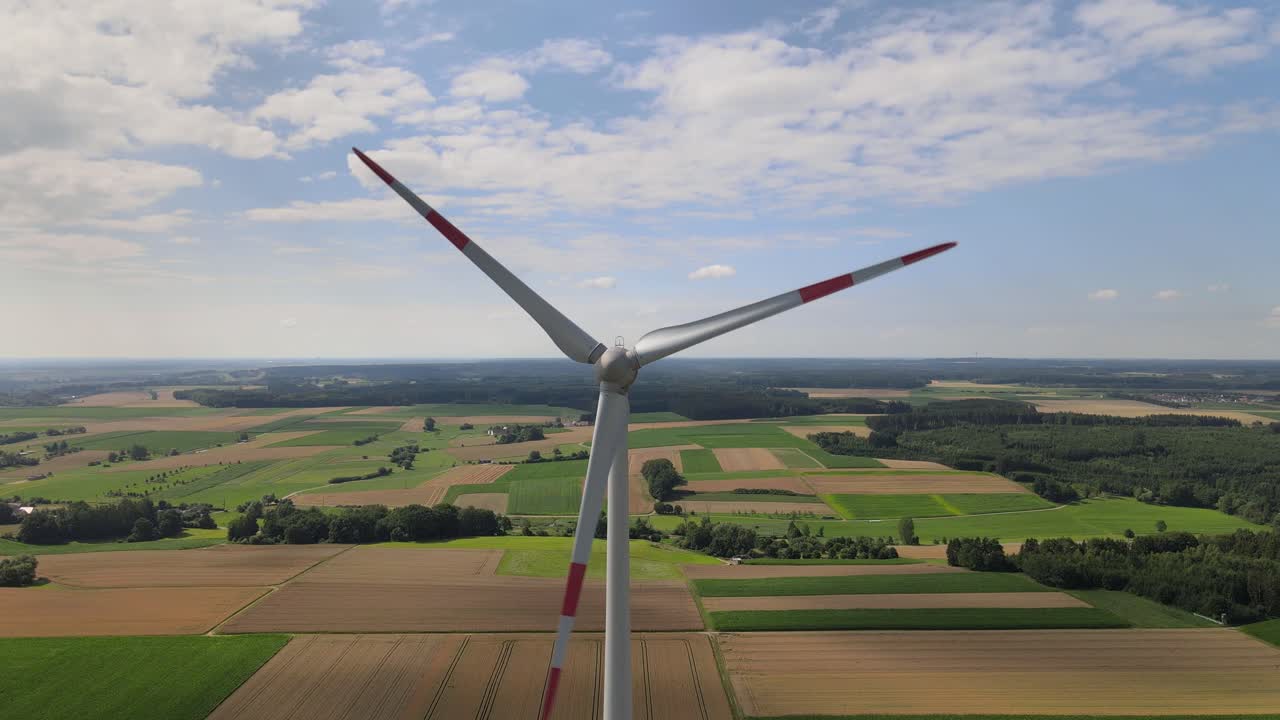Drone shot windmill close at corn field