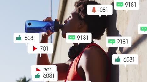 animación de iconos, cambio de números en las barras de notificación, atleta afroamericano bebiendo agua