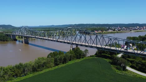 Carl-Perkins-Bridge-crossing-the-Ohio-River-from-Kentucky,-aerial-drone-footage