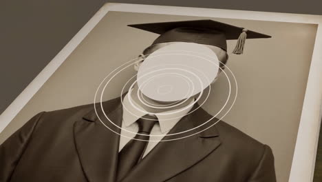 vintage graduation photo with blank face in an album