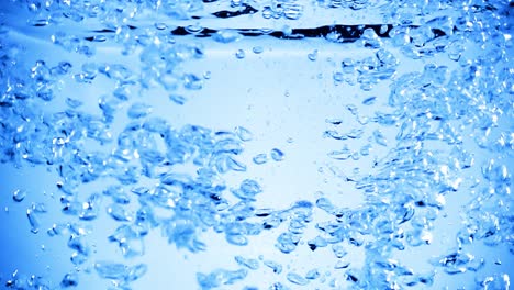muchas burbujas en el agua de cerca, onda de agua abstracta con burbujas en cámara lenta