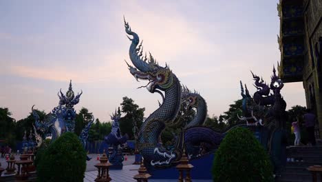 incredible statues at wat rong sear tean (blue temple). chiang rai, thailand.
