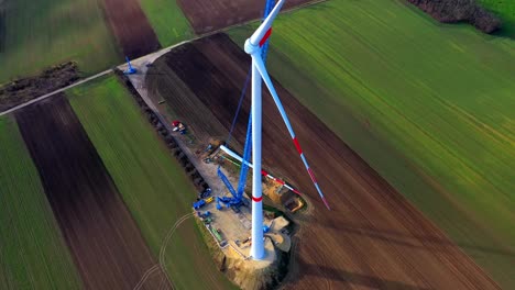 Green-Energy-Wind-Turbine-Under-Construction---aerial-drone-shot