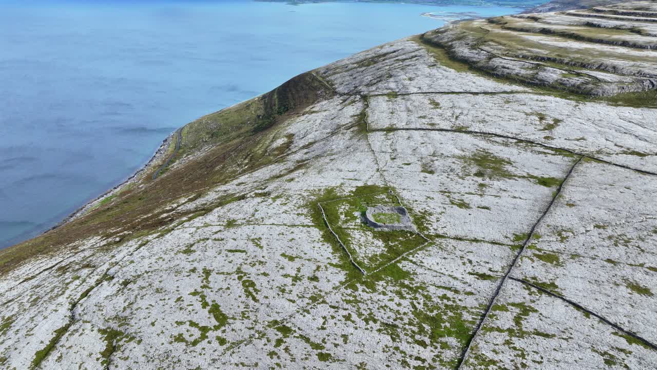 Ireland Epic Locations Iron Age Ring Fort drone view high in The Burren Landscape Clare above Galway Bay wild Atlantic Way Ireland