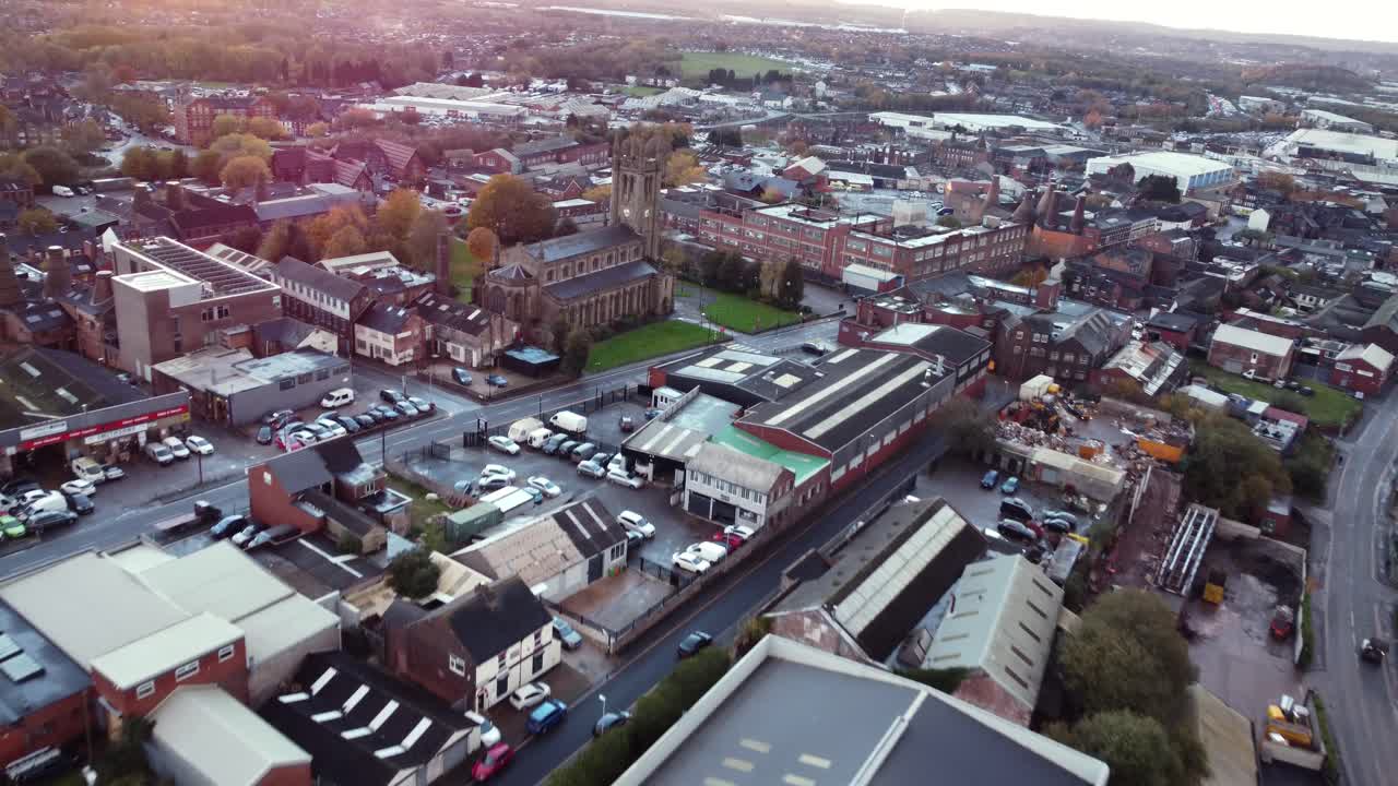 Aerial view of a town with a church and various buildings