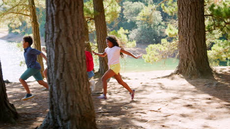 Children-Running-Ahead-Of-Parents-On-Family-Hiking-Adventure