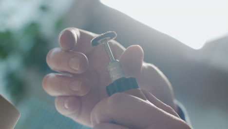 person using small tools and equipment
