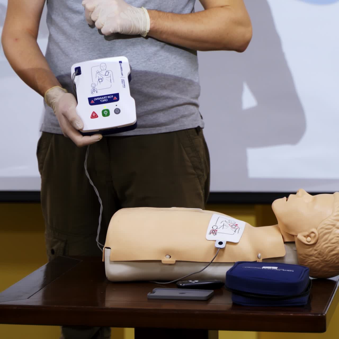 Man teaching cardiopulmonary resuscitation