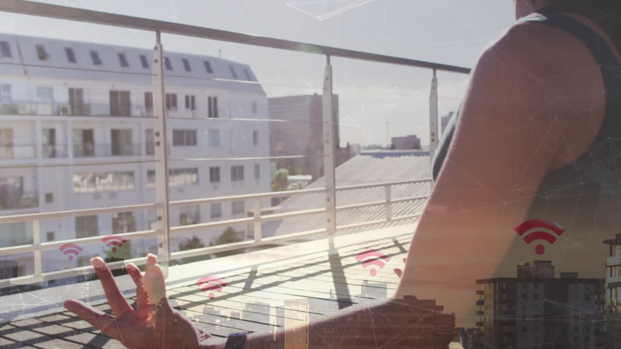 Person meditating on balcony with cityscape and Wi-Fi signal animation overlay