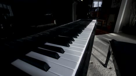 Shot-of-piano-and-keys-in-frame
