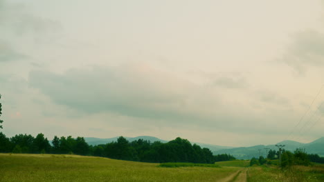 view of beautiful rural landscape forest and clouds