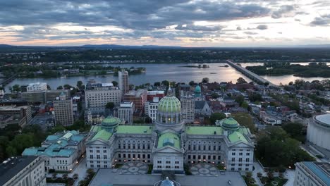 pennsylvania state capitol building with the susquehanna river in the background in harrisburg pa at sunset