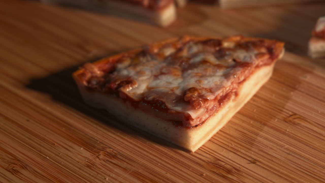 Cutting a slice of pizza