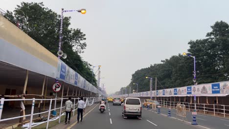 pov shot of red road of kolkata getting ready for durga puja carnival in india.
