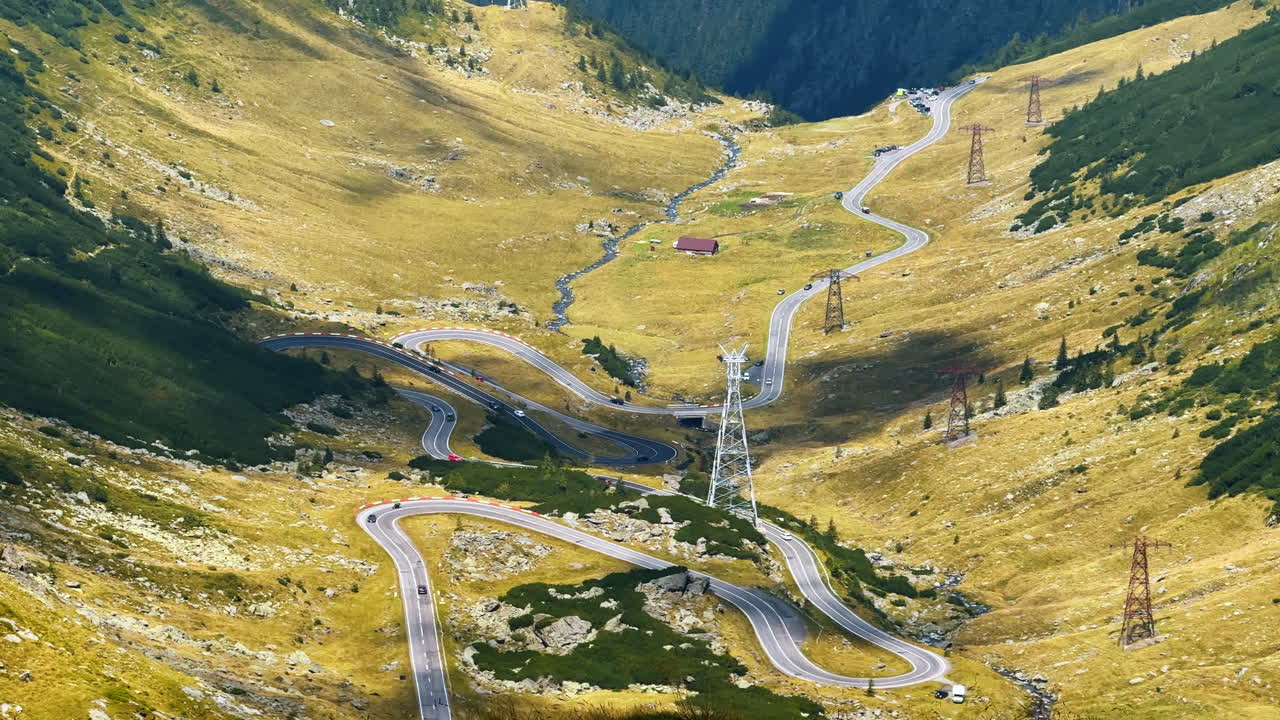 Curves of the Transfagarasan Road in Romania. Close-up aerial of sharp curves and switchbacks of the Transfagarasan road surrounded by mountains