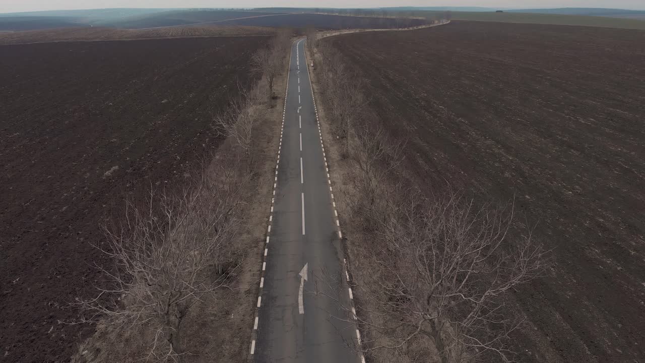 Drone Ascends Over Empty Asphalt Road In The Middle Of Nowhere