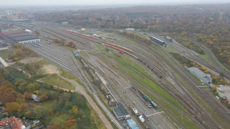 beautiful aerial of parked trains near station in autumn