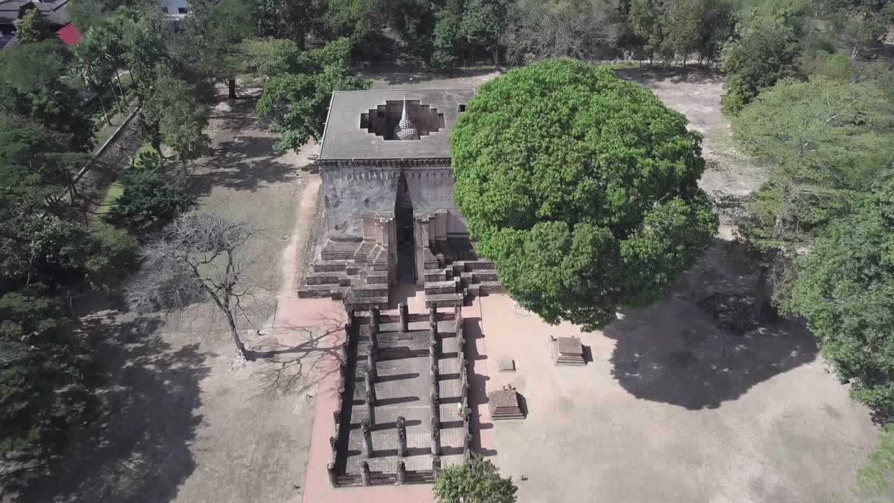 Aerial,Birdseye view towards Wat Si Chum Buddha Statue at Sukhothai,footage stops on the top of the Buddha Statue at its top.