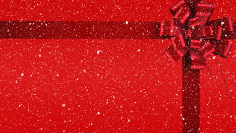 digital animation of red ribbon with gift bow against red background 4k