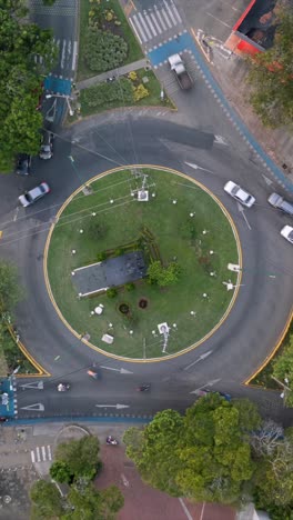 Aerial Ascending Hyperlapse of Roundabout Traffic at Ciudad Jardin. Cali, Colombia. Vertical