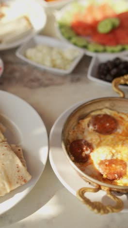 turkish breakfast with eggs and sausage