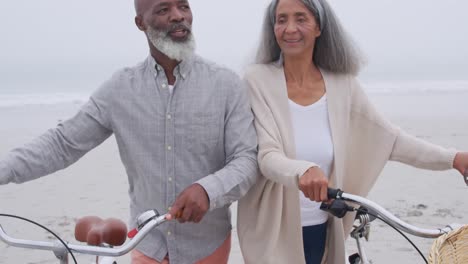 mature couple enjoying time outside by the sea