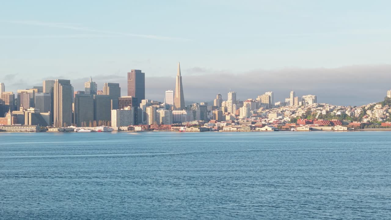 A panning left to right aerial view of the San Francisco Embarcadero taken from Treasure Island. Filmed in 4K.
