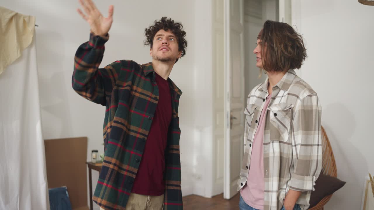 Two Men Discussing a New Apartment